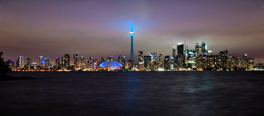 Panoramic view of the Toronto city skyline from the Toronto Islands at night