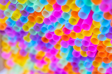 Close up to plenty colorful straws background