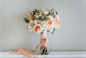 Bridal bouquet. Beautiful blooming bouquet of pastel pink roses with a ribbon - Powered by Adobe