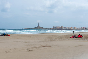 Kiteboards lie on the beach of the Mediterranean after use during a storm. La Manga. Murcia. Spain. March 26, 2019.