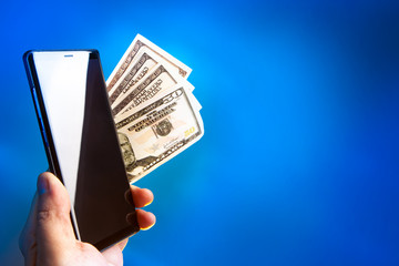 Mobile phone in hand. Payment of mobile communication. Cellular Contract Place for inscription.