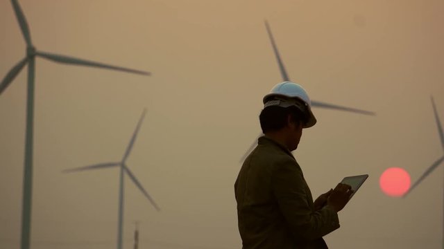 Senior Engineer, Asian are monitoring system wind turbine electricity generation with teblet footage 4K