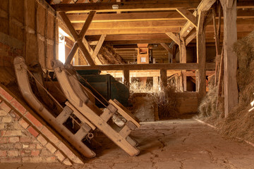Old sled in the utility room. Everyday use devices in the countryside.