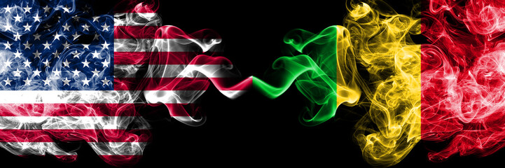 United States of America vs Mali smoky mystic flags placed side by side. Thick colored silky smoke flags of America and Mali