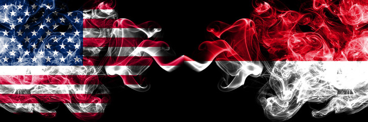 United States of America vs Monaco, Monacan smoky mystic flags placed side by side. Thick colored silky smoke flags of America and Monaco, Monacan