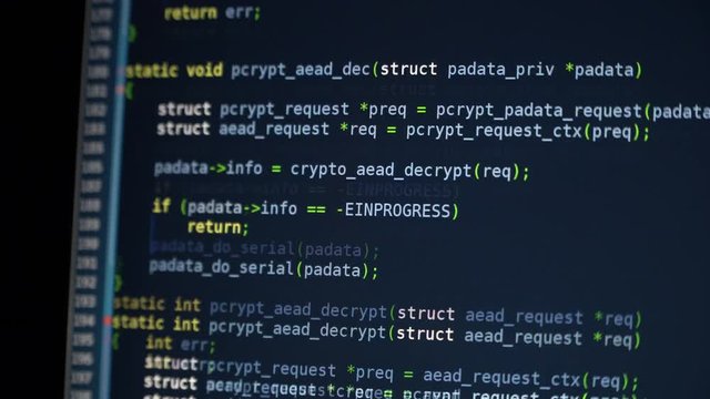 The program code scrolls on the computer screen