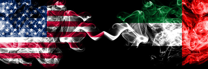 United States of America vs United Arab Emirates, Emirati smoky mystic flags placed side by side. Thick colored silky smoke flags of America and United Arab Emirates, Emirati