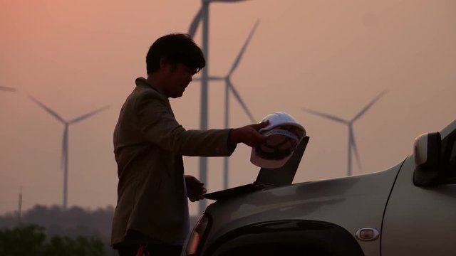 Senior Engineer, Asian are monitoring system wind turbine electricity generation with teblet footage 4K