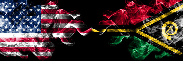 United States of America vs Vanuatu smoky mystic flags placed side by side. Thick colored silky smoke flags of America and Vanuatu