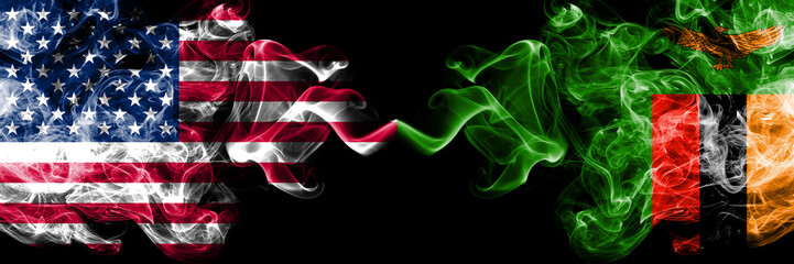 United States of America vs Zambia, Zambian smoky mystic flags placed side by side. Thick colored silky smoke flags of America and Zambia, Zambian