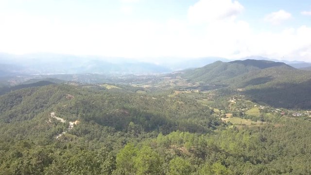 Raising up over the mountains to reveal an amazing blue cloud horizion in Mae Hong Son Northern Thailand