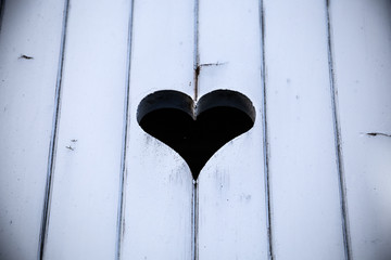 Heart engraved on wooden door