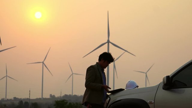 Senior Engineer, Asian are monitoring system wind turbine electricity generation with teblet footage 4K