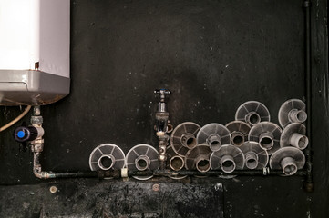 Bunch of reels are drying in a small darkroom.
