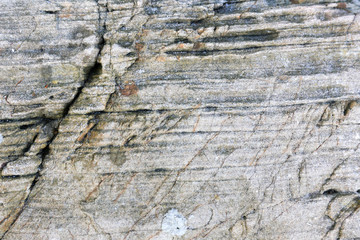 Rock texture and surface background. Cracked and weathered natural stone background.