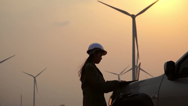 Senior Engineer, Asian are monitoring system wind turbine electricity generation with teblet footage 4K