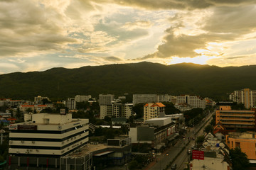 city in a mountain and sunrise