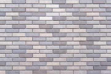 Abstract gray brick wall texture background. Horizontal view of masonry brick wall.
