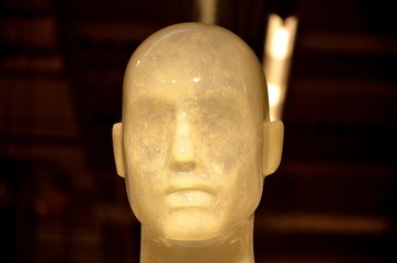 Mannequin head in a boutique showcase, fashion.