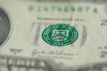 Green stamp on two dollar bill