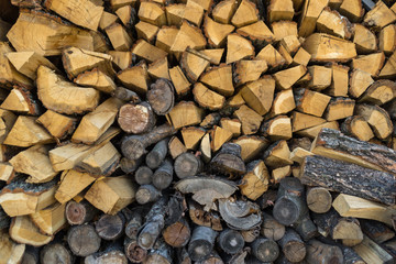 Detailed texture. Natural wall of chopped dry wood. Abstract background