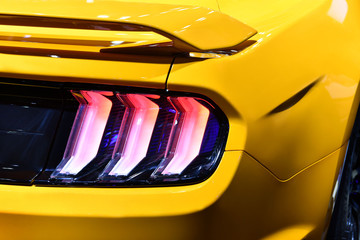 Close-up view of yellow sports car rear light. 