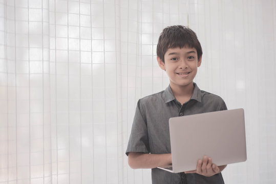 Asian Students Boy Using Laptop Learning In The Classroom At School