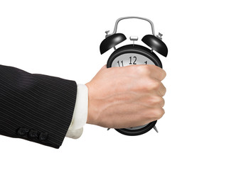 Seizing the time and present opportunities concept. Businessman hand grasping alarm clock, isolated on white background.