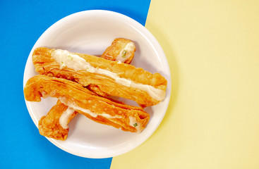 Delicious crispy flour with melt sugar topping on plate.