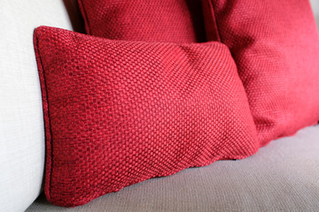 Close up red pillows on a sofa