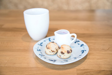 Scone and hot tea on wood table