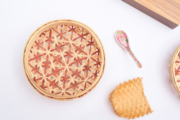Top down angle view of handmade basket and spoon for food