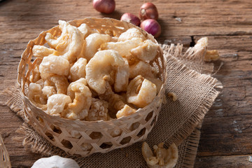 Pork rinds also known as chicharon or chicharrones , kab moo