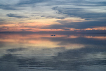 Fototapeta na wymiar Salt lake. Evening sunset with beautiful sky and water.