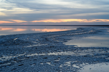 Fototapeta premium Salt lake. Evening sunset with beautiful sky and water.