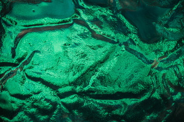 A background image of aqua blue glass with a wavy texture.