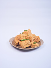 Fried tofu or tahu with petis sauce and chili, javanese traditional indonesian snack