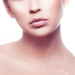 Lips, part of face of beauty model girl. Perfect skin, natural nude makeup. Pale lipstick. Skincare facial treatment concept