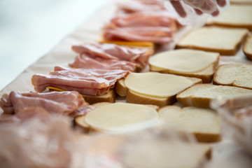 students of coworkers making food for charity or homeless people