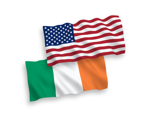 National vector fabric wave flags of Ireland and USA isolated on white background. 1 to 2 proportion.