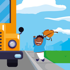 happy little black schoolboy with schoolbag in the bus stop