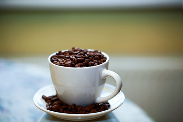 Fried coffee beans close-up - excellent morning breakfast. Black Espresso.