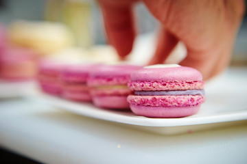 Pink macaroons on plate
