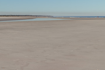 empty isolated beach with lots of beautiful sand