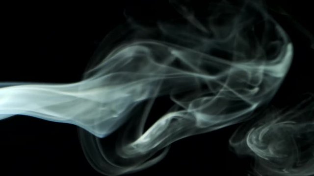 Vertical video screensaver - Thin trickle smoke slowly rising graceful twists up on black background. Cigar smoke blowing from the left side. Great for editing, without color correction and grading.  