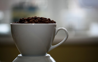 Fototapeta premium Fried coffee beans close-up - excellent morning breakfast. Black Espresso.