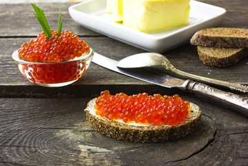 red caviar on black bread with butter. Healthy food. Fish appetizer.