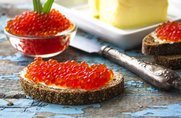 red caviar on black bread with butter. Healthy food. Fish appetizer.