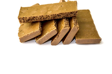 milky, porous chocolate on a white background