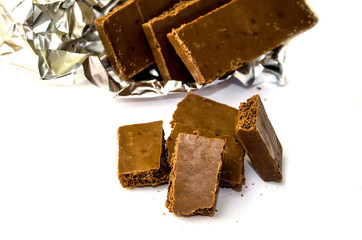 milky, porous chocolate on a white background